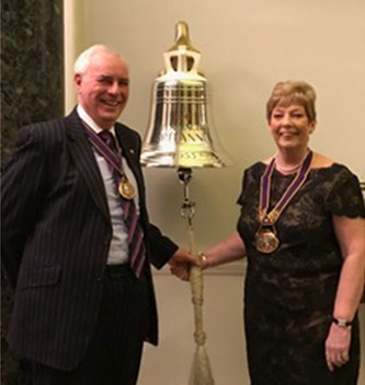 Senior Warden Steve Thomas ringing the Trinity House bell with the Master, Barbara Harding
