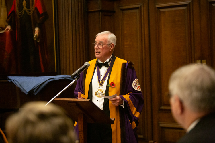 Outgoing Master Stephen Thomas presenting the Annual Report to members